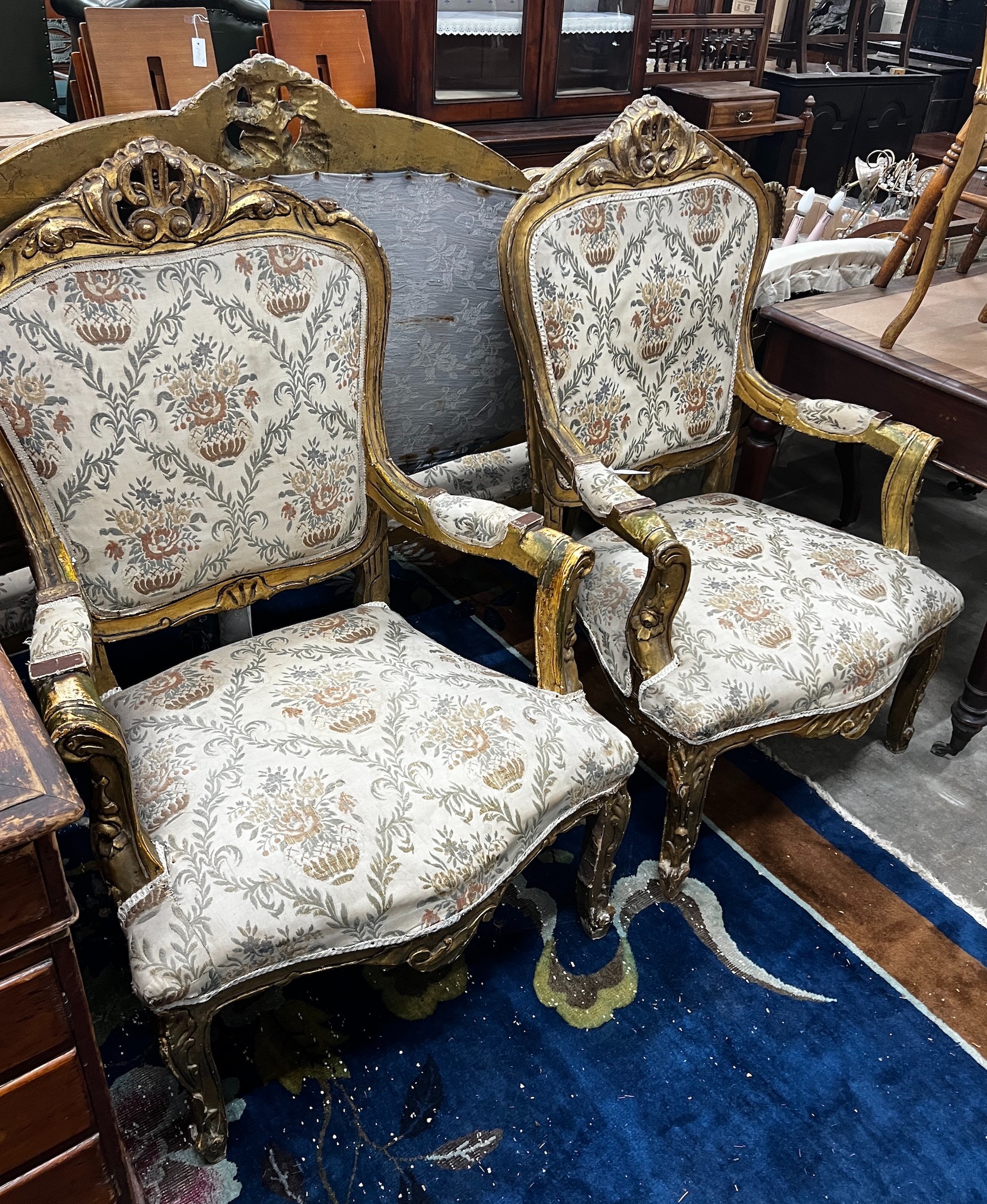 A Louis XV style giltwood and gesso three piece salon suite